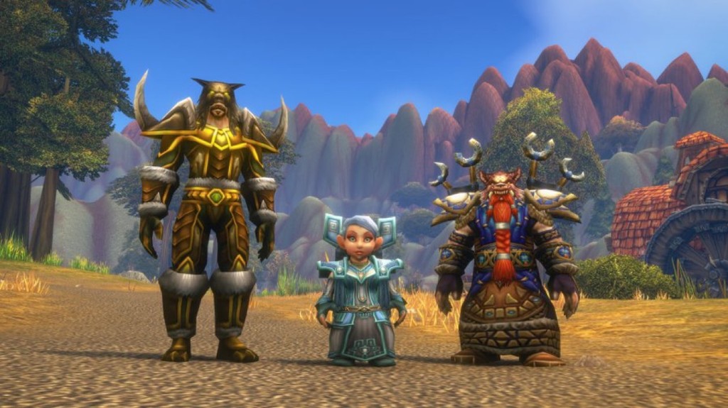 Gnome Priest and Dwarf Shaman standing in an Alliance zone, with a Tauren in gold plate on the left.